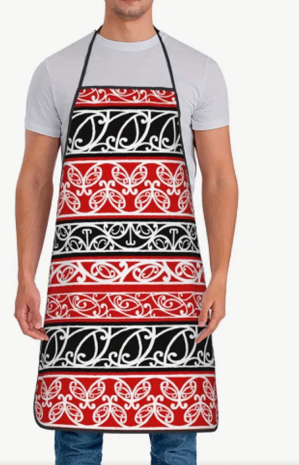 Person wearing a red, black, and white patterned apron on a white background