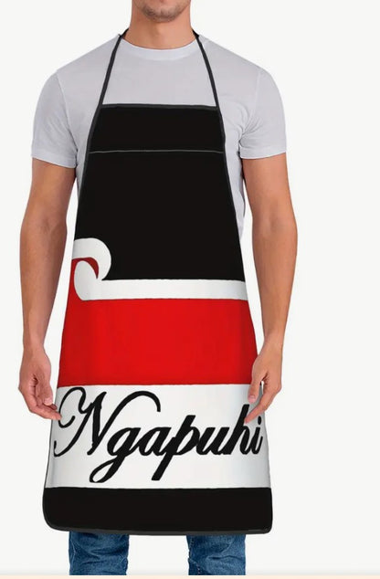 Person wearing a black, red, and white apron with 'Ngapuhi' text.